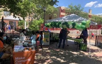 Children painting ceramic flower pots with Park to Park 103. Photo: Naomi Yaeger