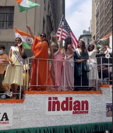 Beauty queens aboard The Indian American float.