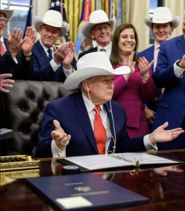 Rep. Elise Stefanik (in magenta) with President Trump and the 1980 U.S. Men’s Olympic Hockey Team, Dec. 12, 2025.