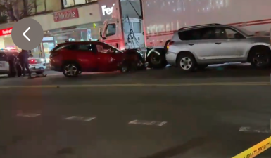 A red Hundai Tuscon SUV operated by a 49 year old male struck an unoccupied NYPD cruiser, a Lexus, a Toyota Rav 4, several pedestrians and two delivery workers, killing one of them. The driver was charged with manslaughter and driving under the influence.