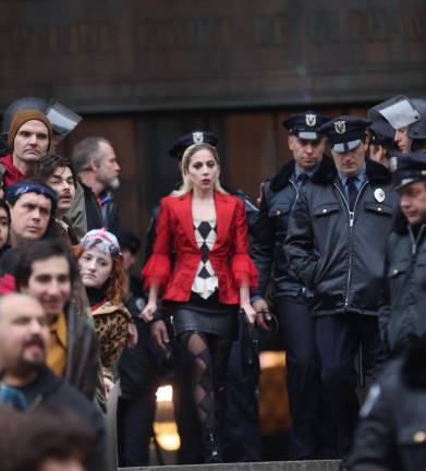<b>Lady Gaga, who plays the role of the Joker’s love interest Harley Quinn in Joker: Folie a Deux, struts down the steps of the New York State Supreme Court Building at 60 Center Street with slicked back blonde hair and clown grease paint on her face. </b>Photo: Steve Sands/NY Newswire