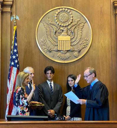 Jack Schlossberg (center) turned up at the influential Lexington Democratic fall social and is said to be considering a run for Jerry Nadler’s Congressional seat next year. He has not held elected office but has been around politics his whole life. Here, he watches his mom, Caroline Kennedy Schlossberg, being sworn in as ambassador to Australia in 2022.
