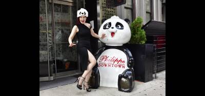 Karen Rempel plays with Philippe Chow’s panda.