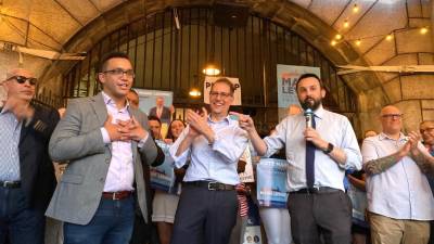 Shaun Abreu (left) rejoices with City Council Members Mark Levine (center) and Keith Powers (with mic) after Abreu’s victory in the Democratic primary for City Council District 7. Photo courtesy of Abreu’s campaign