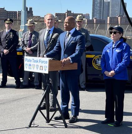 <b>Mayor Eric Adams with MTA chairman Janno Lieber (left) and Governor Kathy Hochul (right)ntalked about a new multi-agency task force to combat fraudulent license plate use that reportedly costs the MTA $50 million a year.</b> Photo: Ralph Spielman