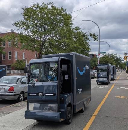 Convoy of Amazon cargo trucks on the Brooklyn Waterfront Greenway, June 2025. Another Amazon truck is on Columbia Street at far left.