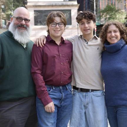 Rabbi Stephanie Ruskay (right), husband Darren (left) and their two sons.