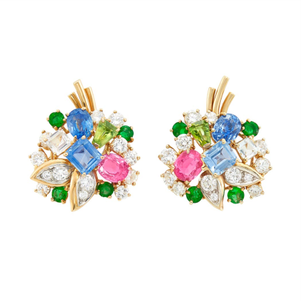 Gold sapphire emerald diamond earclips are included among the $45,000 in jewelry that prosecutors say retired professor Lawrence Gray stole from high end friends and then pawned through a Manhattan auction house. Photo: Manhattan DA’s office.