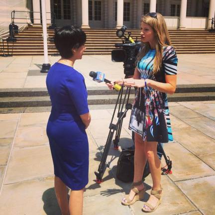 Jen Maxfield (right) reporting at City Hall for NBC News. Photo courtesy of Jen Maxfield