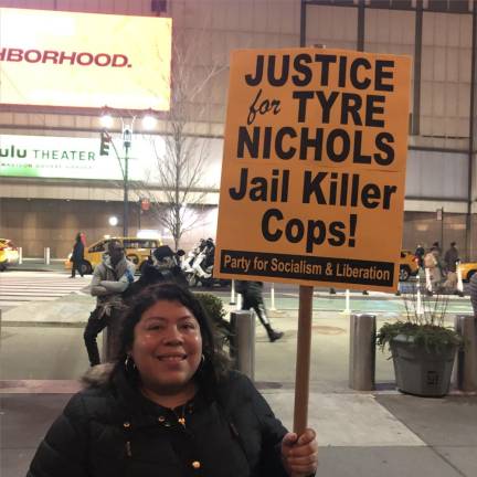 One protestor, Karla Reyes who said she is a public school teacher, said police everywhere “have to stop criminalizing black men.” Photo: Keith J. Kelly