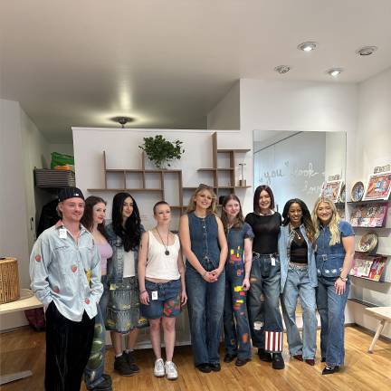 McKenna Camille stands with her models on the night of her NYFW pop up show at Neighbor gallery in Chelsea.