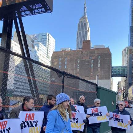 Portestors at the site of the historic Hotel Pennsylvania which was demolished earlier this year even as the lots owner, Vornado Realty Trust, was delaying indefinitely its plan to build new office towers in the area. Local activists want housing to be built there instead. Photo: Michael Oreskes