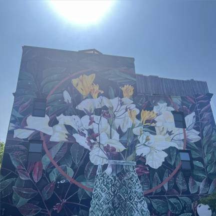 A pollutant-absorbing mural called “Botanical Pulse” now graces a building abutting Hell’s Kitchen Park.