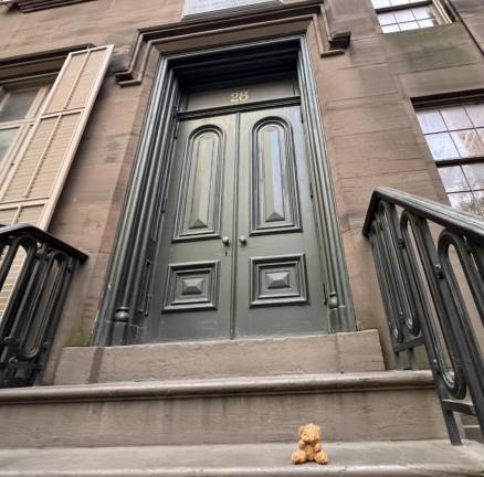 A teddy bear on the steps of Theodore Roosevelt Birthplace, 28 E. 20th St.