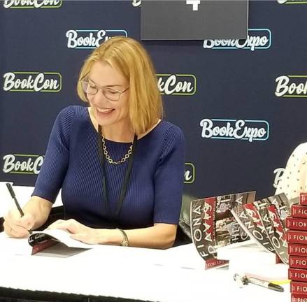 Fiona Davis signing copies of her book “The Chelsea Girls.” Photo courtesy of Fiona Davis