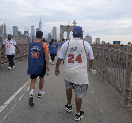 Knicks parade pilgrims including Bill Bradey and Allan Houston walking in from Brooklyn.