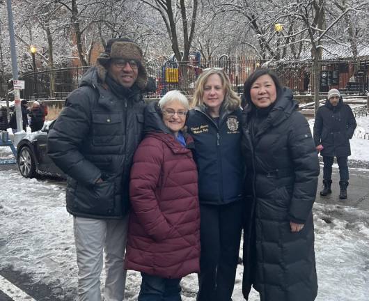 Lynn Schulman (maroon coat) flanked by Queens BP Donovan Richards, Queens DA Melinda Katz, and Congresswoman Grace Meng at a recent menorah lighting in . . . Queens!