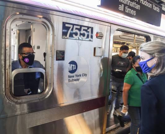 Interim New York City Transit President Sarah Feinberg greets a conductor at the 74 St-Broadway Station on the 7 line on opening day, May 8, 2020. ( Photo: Marc A. Hermann / MTA New York City Transit)