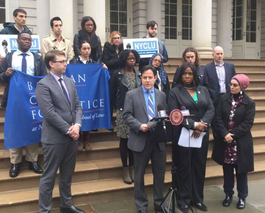 Council Members Dan Garodnick and Vanessa Gibson (center) speak at a March press conference announcing legislation that would require increased police transparency. Photo: Michael Garofalo