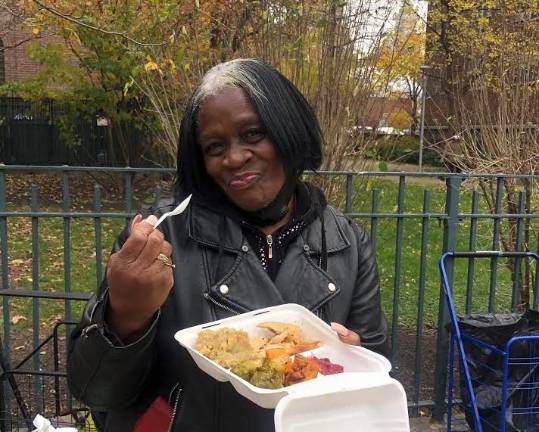 Guests now eat outside of the church in accordance to safety guidelines for COVID-19. Photo courtesy of Holy Apostles Soup Kitchen.