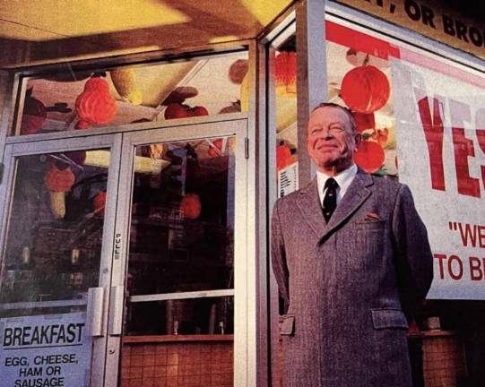 Nicholas Gray, pictured in front of his eponymous and still-standing hot dog store Gray’s Papaya, popular for merging dogs with a drink made of “the aristocratic melon of the tropics.” Gray passed away on May 19th.