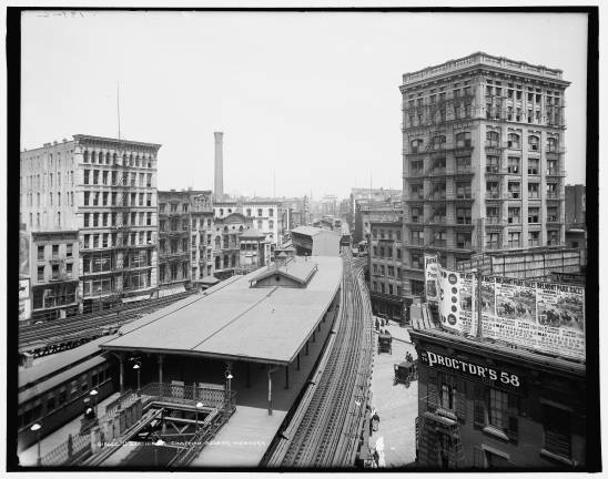 Chatham Square looking south c. April 1905. Signs at right advertise May horse races at Belmont Park.