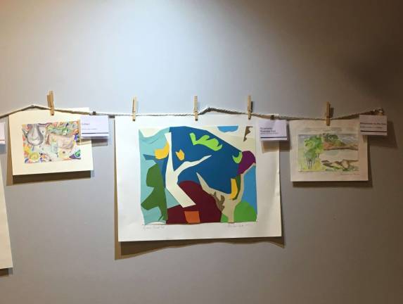 "Sycamores, Riverside Park," center, by Ruth Kozodoy, a Bloomingdale Aging in Place member, was among the works at a clothesline art show at the HI New York City Hostel last weekend. Photo: Caitlin Hawke