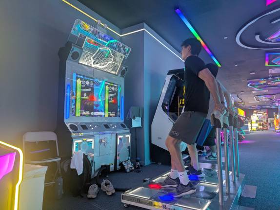 Gamers playing Dance Dance Revolution in the Max Funland at Golden Mall Fidi.