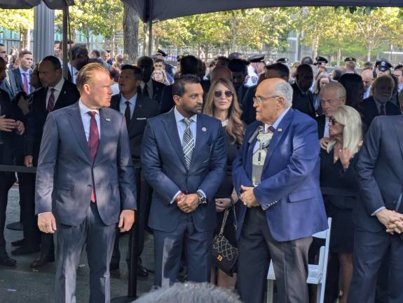 Big Tent: FBI Director Kash Patel flanked by Andrew (left) and Rudy Giuliani; FBI Deputy Director Dan Bongino left behind; Deputy Mayor Randy Mastro right hand; NYPD Chief James McCarthy PBMS in white shirt, rear.