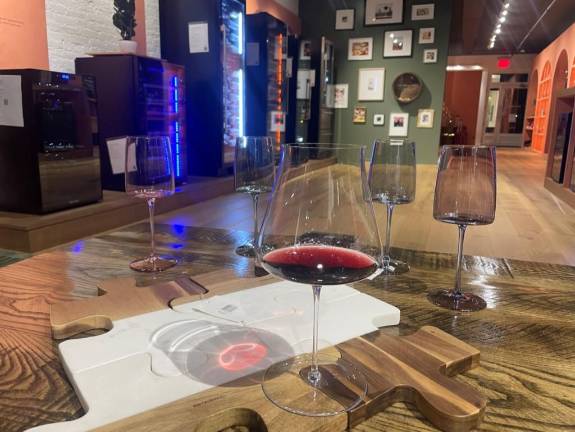The retail store does not sell bottles of wine, but customers can enjoy a sample while trying out glassware.