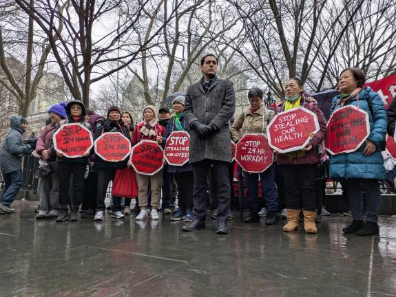 Christopher Marte and home health aide workers outsided City Hall on Feb. 18, 2026.
