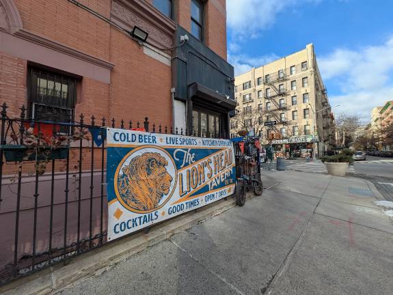 The Lion’s Head Tavern looking west. Basement entrance is behind the banner.