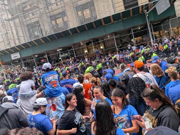 Knicks parade crowd jams Broadway, NYPD Strategic Response Cops on bicycles in yellow.