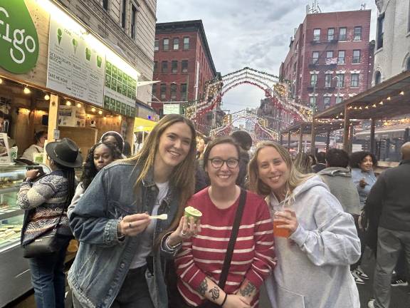 Attendees enjoy Figo gelato at the Feast of San Gennaro on Sept. 25 before the weekend rain.