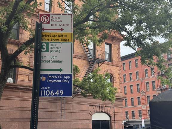 Signs for a new app-controlled parking system went up in the dead of night on the UWS (76th Street and Columbus Avenue shown above). The new metering system abolishes the all-day parking allowed under the city’s traditional alternate-side-of-the-street parking rules.