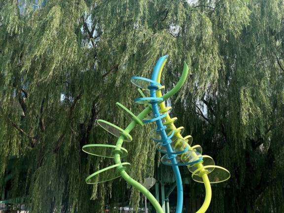 Life Dance, designed by Susan Markowitz Meredith, is composed of three intertwining, colored steel tubes, with attached plexiglass steps, that rise 11 feet into the air.