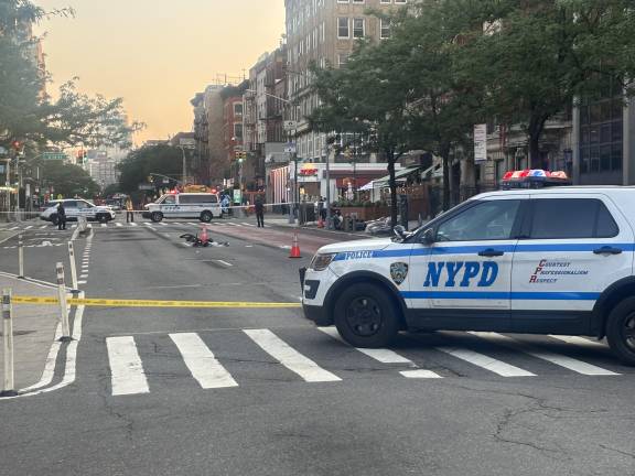 A collision between an e-biker and a car resulted in the shutdown of Second Avenue between 14th and 15th streets on July 29. The driver was later arrested; the biker was taken to Bellevue in critical condition.