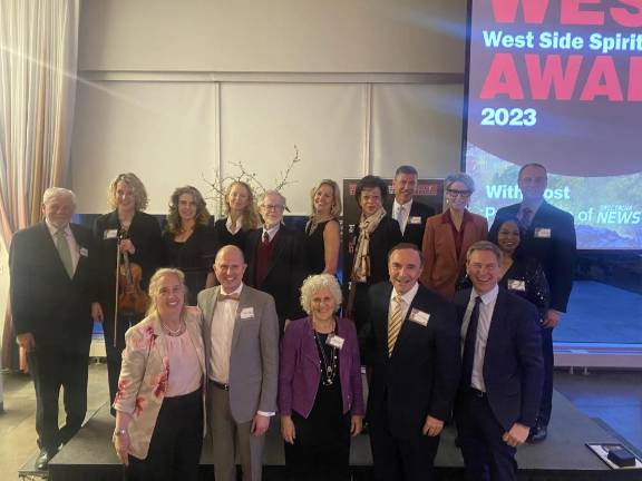 Back row, left to right: Editor Keith J. Kelly, Concertmaster Joybe Hammann, MZ Wallace’s Lucy Wallace Eustice and Monica Zwirner, former Assembly Member Richard Gottfried, Team TLC NYC’s Ilze Thielmann, Lincoln Center’s Leah Johnson, Mount Sinai’s Dr. Brendan Carr, Plaza Jewish Community Chapel’s Stephanie Garry, 20th Precinct Commanding Officer Neil Zuber, and Frederick Douglass Houses’ Carmen Quinones. Front row: City Council Member Gale Brewer, Folk Art Museum’s Jason T. Busch, Publisher Jeanne Straus, Lighthouse Guild’s Dr. Calvin Roberts, and the event’s emcee, NY1’s Pat Kiernan.