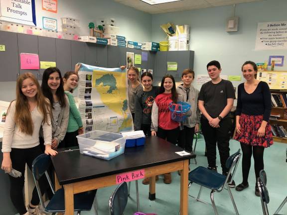 West End Secondary School&#x2019;s Green Team poses with their oyster research equipment and an exhibition chart. Photo: Ashad Hajela