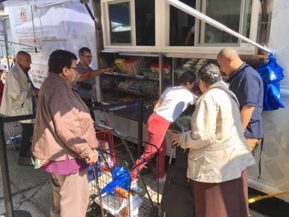 Lincoln Square neighbors try out WSCAH's new mobile pantry. Photo: Leslie Gersing