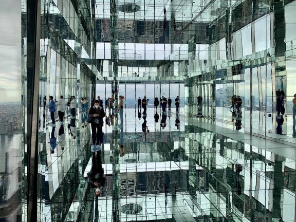 The main gallery, Air, makes for interesting perceptions, between all the mirrored surfaces, and four of the five New York City boroughs at your feet. Designed by Kenzo Digital. Photo: Ralph Spielman