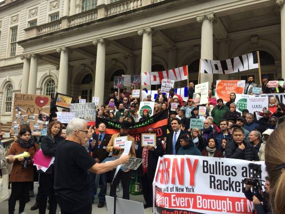 About 300 people assembled at City Hall Saturday afternoon to call attention to the rate by which New York neighborhoods are being sacrificed to developers, often at the expense of longtime residents and small businesses. Photo: Spencer Lee