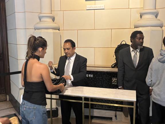 Tighter security was evident inside St. Patrick’s Cathedral as visitors have their bags searched.