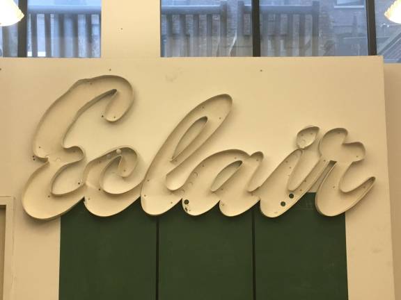 All that remains of the Caf&#xe9; &#xc9;clair on West 72nd Street is this fragment of its old metallic sign, which hangs in the office of Landmark West! on West 67th Street. Photo: Courtesy of Landmark West!
