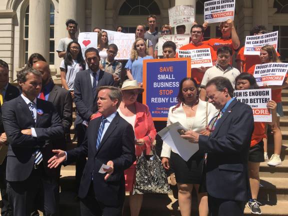 Mel Wymore (center) who is running for City Council District 6, spoke out in support of small businesses at a rally Wednesday afternoon. The political hopeful promised to prioritize the passage of the Small Business Jobs Survival Act if elected.&#xa0;Photo: Madeleine Thompson