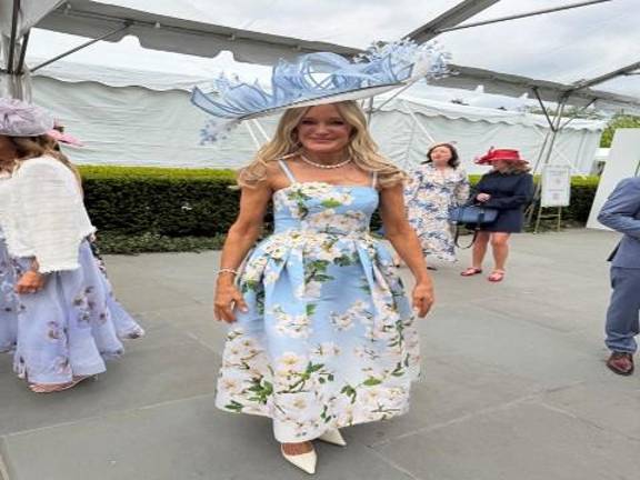 Tracey Huff, Women’s Committee president added to her hat with a soft cerulean spring flowered dress and sparkling diamond sunflower necklace created by Harry Winston.
