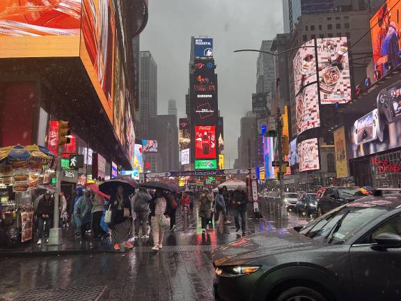 The busy, if wet, Diwali Times Square scene near the booths.