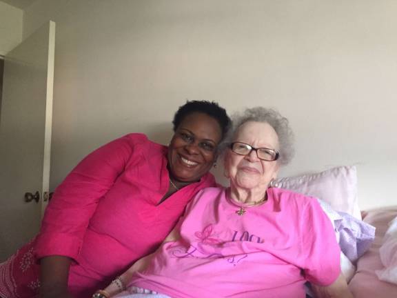 As part of Columbia University School of Nursing house-call service in Washington Heights, nurse practitioner Marie Carmel Garcon, left, has been making regular home visits to Iris Brady Boteler for a year. Photo: Natasha Roy
