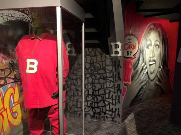 The Music Gallery is covered from the Mid-Twentieth Century to today, from the Beatles to CardiB. Here, we see Notorious B.I.G.’s tracksuit, and a representation of Cardi B on the wall. Photo: Ralph Spielman