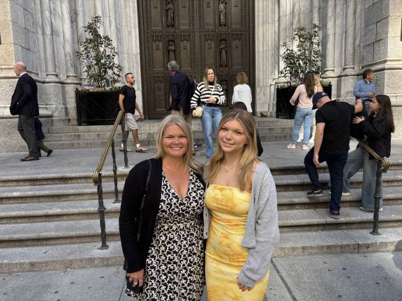 Deanna Sienkiewicz and daughter Lily on the steps of St. Patrick’s Cathedral.